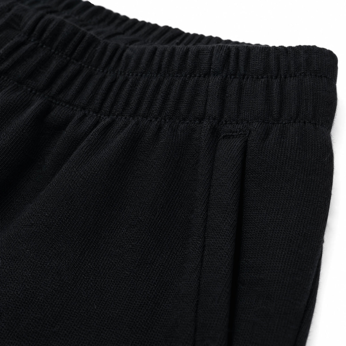 Pantalon Fuseau Femme à Passe-Pieds Noir ou Blanc - close-up détail matière