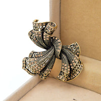 broche-en-alliage-darc-vintage